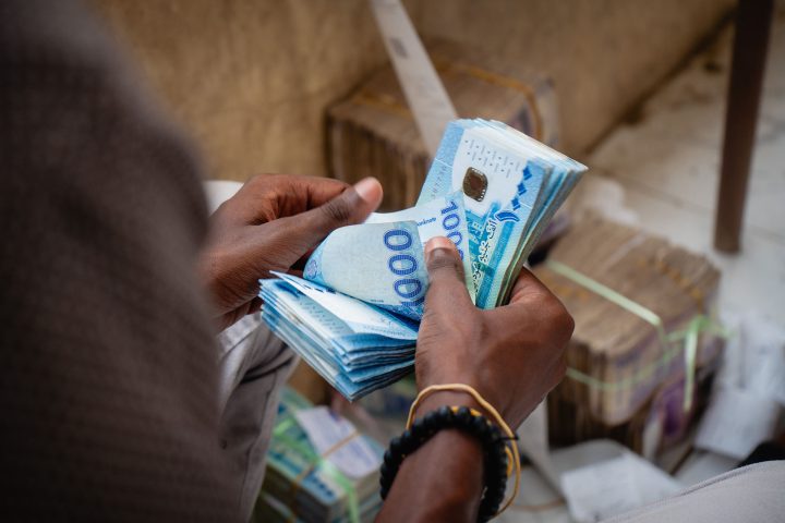 Women in front of mural